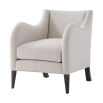 A stylish armchair with a grey upholstery, chic curves and wavy armrests 