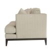 A modern sofa with a neutral linen upholstery and complementary scatter cushions