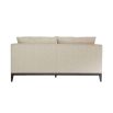 A modern sofa with a neutral linen upholstery and complementary scatter cushions