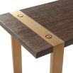 A luxury end table with a brushed brass base and walnut coloured table top