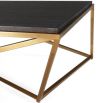 Contemporary coffee table with brass base and black top 