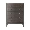 A tall chest of drawers with a luxury design featuring embossed leather, tapered legs and polished nickel adornments