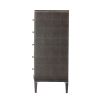 A tall chest of drawers with a luxury design featuring embossed leather, tapered legs and polished nickel adornments