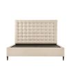 A sumptuous bed with a padded deep buttoned back and cream finish