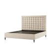 A sumptuous bed with a padded deep buttoned back and cream finish