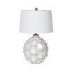 A unique table lamp featuring a hexagonal textured base with a beautiful white finish
