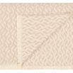 Light brown throw with tonal pattern and subtle fringing