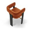 A luxury counter stool with a red and orange velvet upholstery and brass detailing