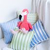 A gorgeous children's cushion with a unique pattern, light green colour and finished with white piping 