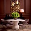 Travertine dining table with round top and structural base