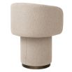 A stylish dining chair with a luxury beige upholstery and unique silhouette