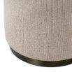 A stylish dining chair with a luxury beige upholstery and unique silhouette