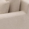 A sophisticated armchair with a luxury beige upholstery