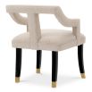 A stylish dining chair with a distinctive silhouette and luxury beige upholstery