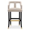 A contemporary bar stool with an 18th century French-inspired design