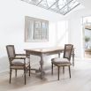 Rustic grey wash dining table with a small drawer and gorgeous silhouette