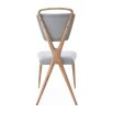 A stylish dining chair by Jonathan Adler with a unique design