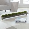 artificial moss display in long, distressed container