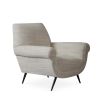 A luxurious natural-toned armchair with black tapered legs