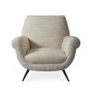 A luxurious natural-toned armchair with black tapered legs