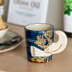 White mug with bird style handle