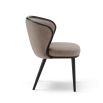 A luxury recycled velvet upholstered dining chair with a curved backrest