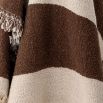 Natural throw with abstract brown design and tassels