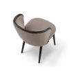 A luxury recycled velvet upholstered dining chair with a curved backrest