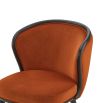 A statement recycled velvet upholstered dining chair with a curved backrest