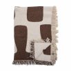 Natural throw with abstract brown design and tassels