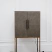 Elegant bar cabinet with shagreen finish and brass accents