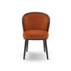 A statement recycled velvet upholstered dining chair with a curved backrest