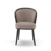 A luxury recycled velvet upholstered dining chair with a curved backrest