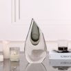 Elegant glass vase in smooth teardrop shape with a hint of grey