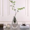 Elegant glass vase in smooth teardrop shape with a hint of grey