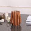 Stunning vase composed of brown leather and glass