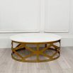 A chic white marble and brass coffee table