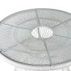 White rattan dining table with glass top