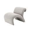 A contemporary chair by Eichholtz with a luxury boucle upholstery