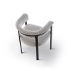 Elegant boucle upholstered dining chair in grey with black frame