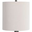 This ceramic table lamp features a textured rust and aqua pattern, brushed nickel accents, and a beige linen shade