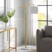 Sleek floor lamp with marble base and gold fixture
