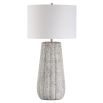 This ceramic lamp features a weathered stone finish, brushed nickel accents, and a soft off-white linen shade, bringing timeless elegance and classic sophistication to any space.