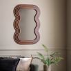 Brown wooden mirror with wavy edge frame