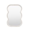 Wall mirror with a wavy edge detailing