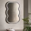 Wall mirror with a wavy edge detailing
