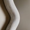 Wall mirror with a wavy edge detailing