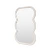 Wall mirror with a wavy edge detailing