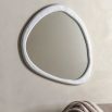 Wall mirror with a wavy concrete-effect frame