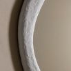 Wall mirror with a wavy concrete-effect frame
